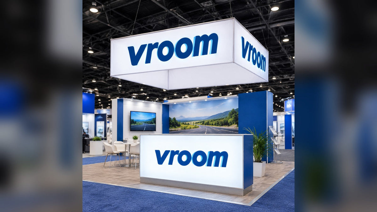 Trade show hanging sign and fabric light box in an exhibition booth